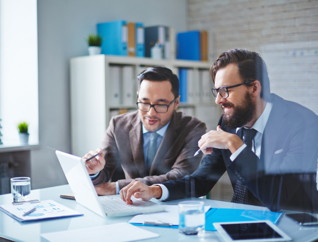 Consultants discussing business performance strategy